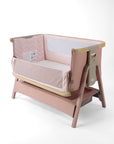 CoZee Air 2 bedside crib in blush, with open side, storage, 6 height positions in a white background