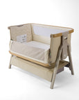 CoZee Air 2 bedside crib in sand, with open side, storage, 6 height positions in a white background