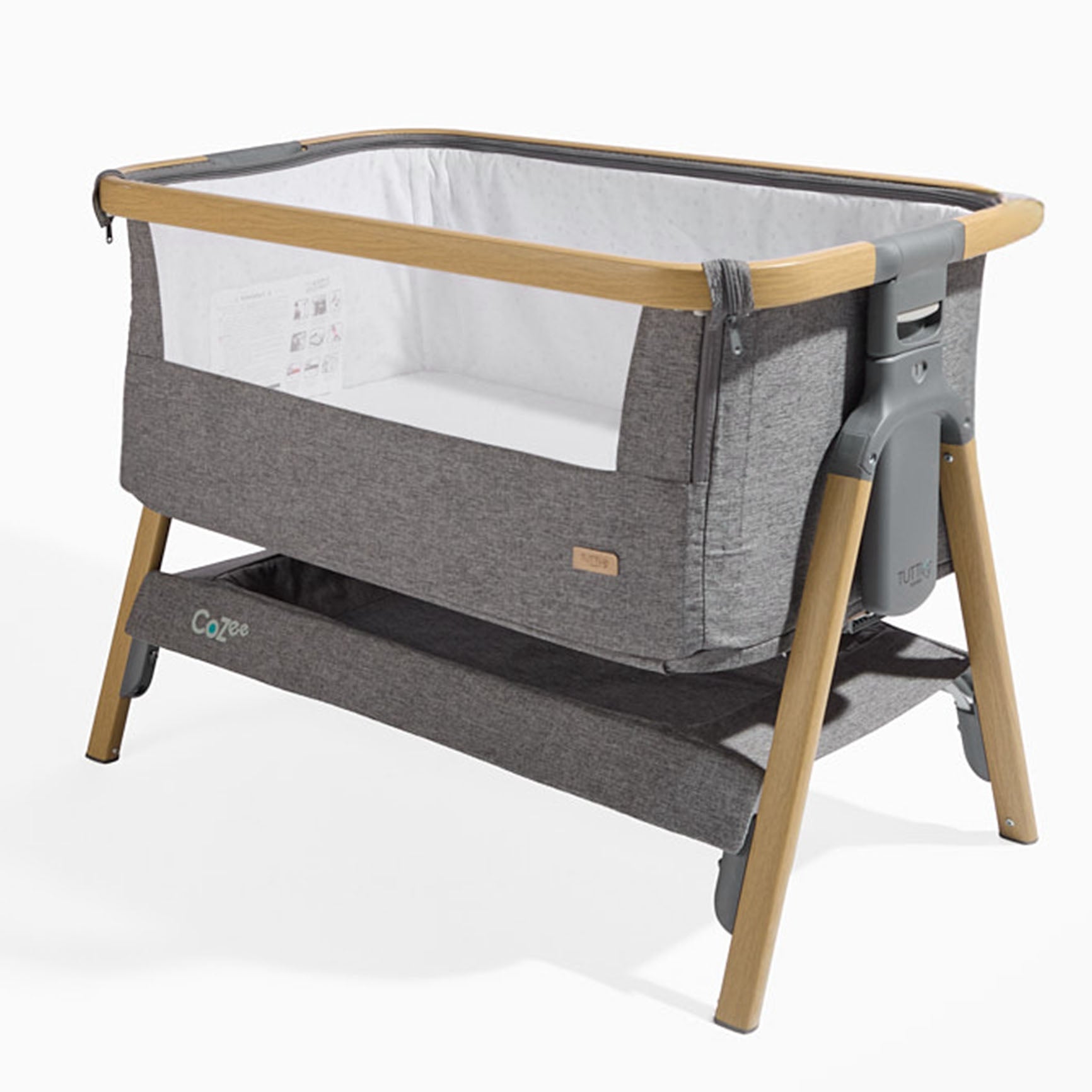 CoZee Bedside Crib in Oak and Charcoal > breathable mesh sides for enhanced airflow and bottom storage to keep your babies essentials.