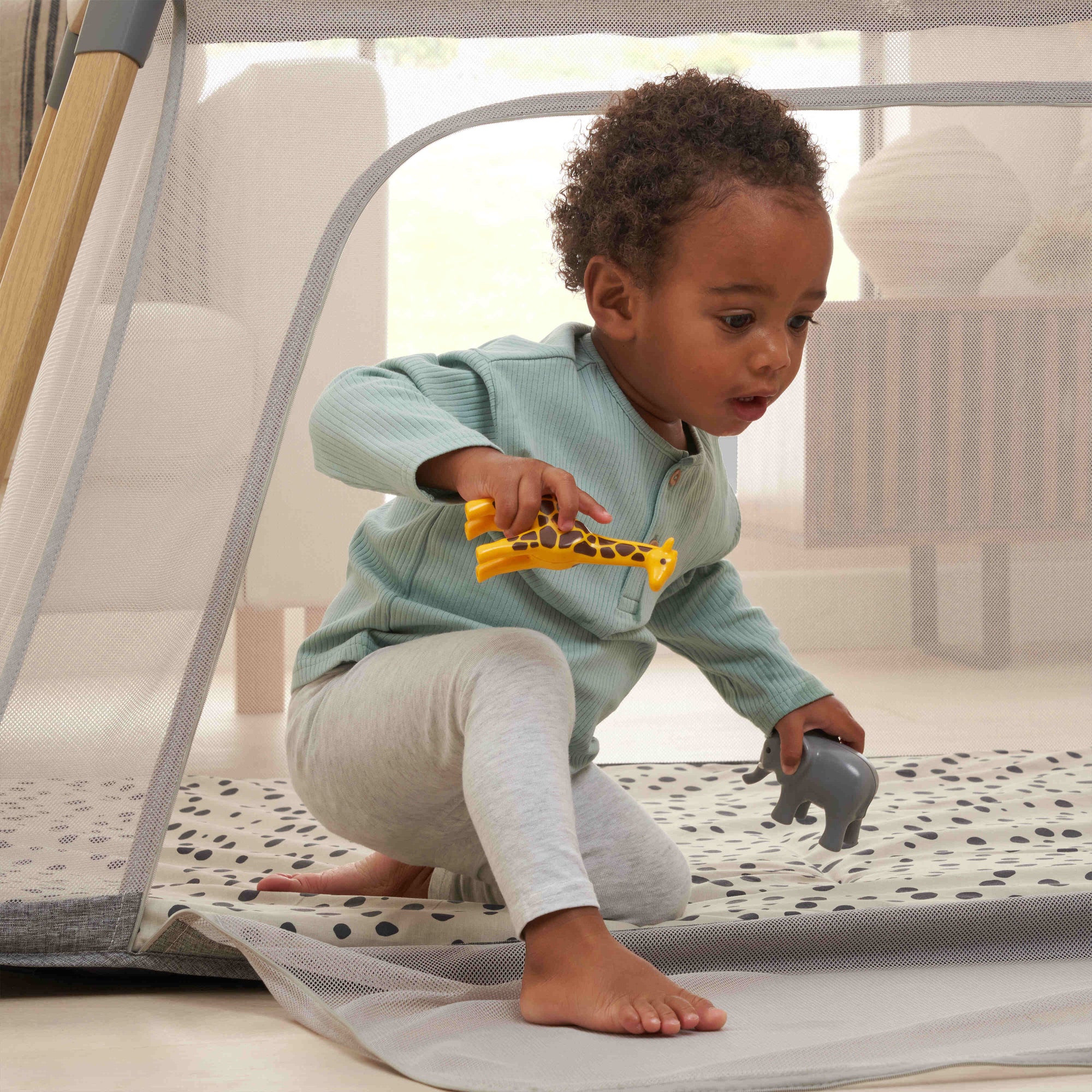CoZee Go Travel Cot > zip-down side panel for easy toddler access during playtime