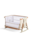 Angled cutout of the CoZee Scandi bassinet in side-down mode, highlighting breathable mesh panels and compact frame