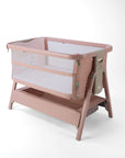 CoZee Zen pink baby crib with mesh side on a white background