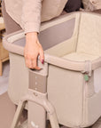 Close-up of the CoZee Air 2 in cocoa showing height-adjustable frame with easy-to-use settings for a secure, bedside fit.