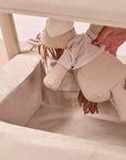 Close-up of the CoZee Air 2 in cocoa showing the lower storage shelf, ideal for keeping toys and baby essentials within easy reach.