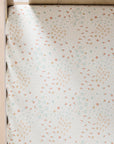 Farm-patterned fitted sheet from the Good Life on a bed corner
