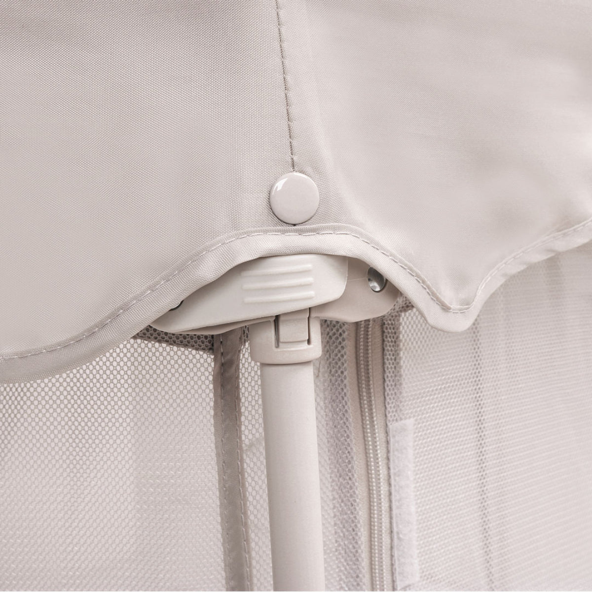 Close-up of the Hexa Playpen's closing mechanism in Mushroom Terrazzo, highlighting secure clip detail and reinforced frame stitching