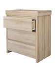 The Modena changing unit in oak features three spacious drawers for ample storage.