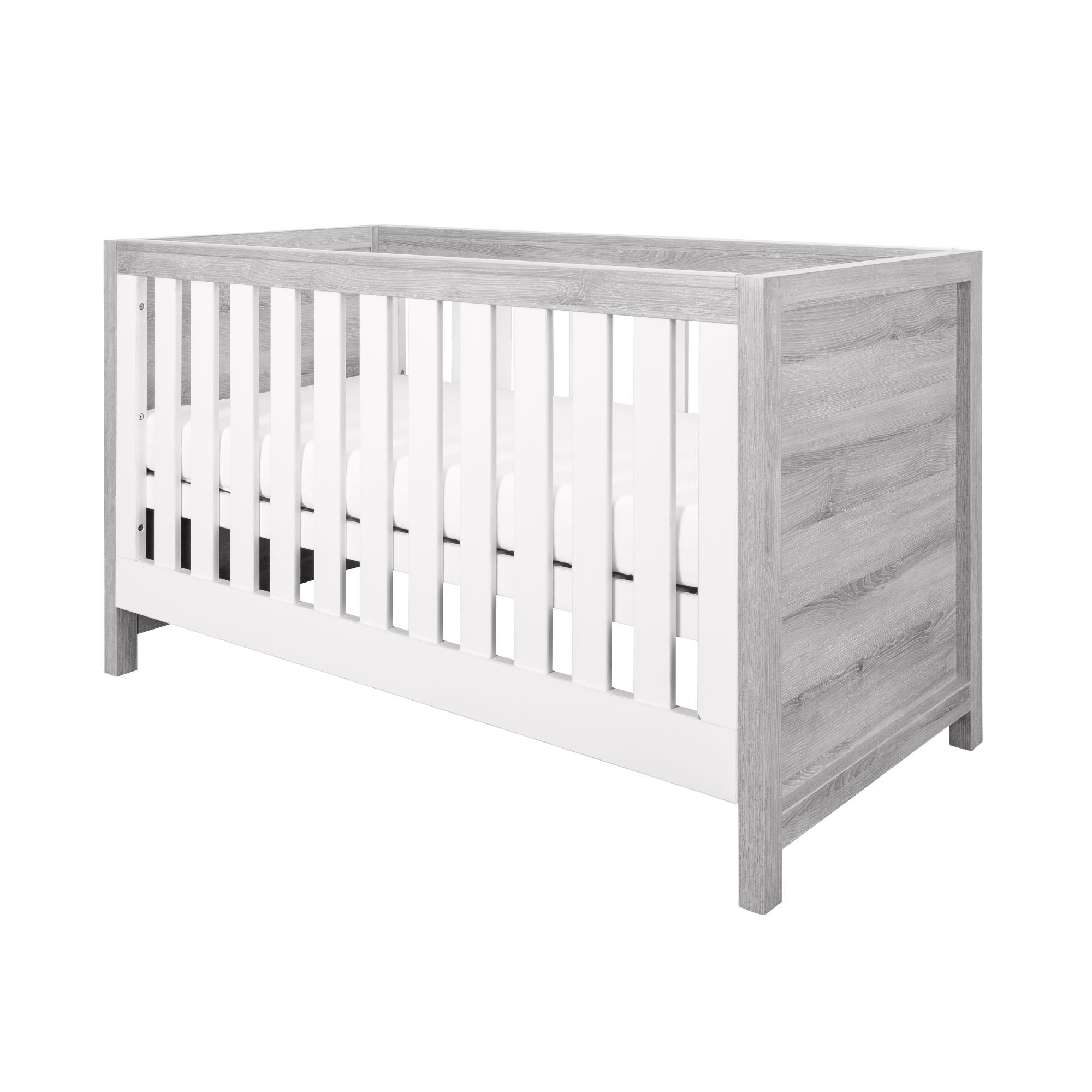 Angled product shot of the Modena Cot Bed in Grey Ash and White with slatted sides and solid panels, perfect for modern nursery interiors.