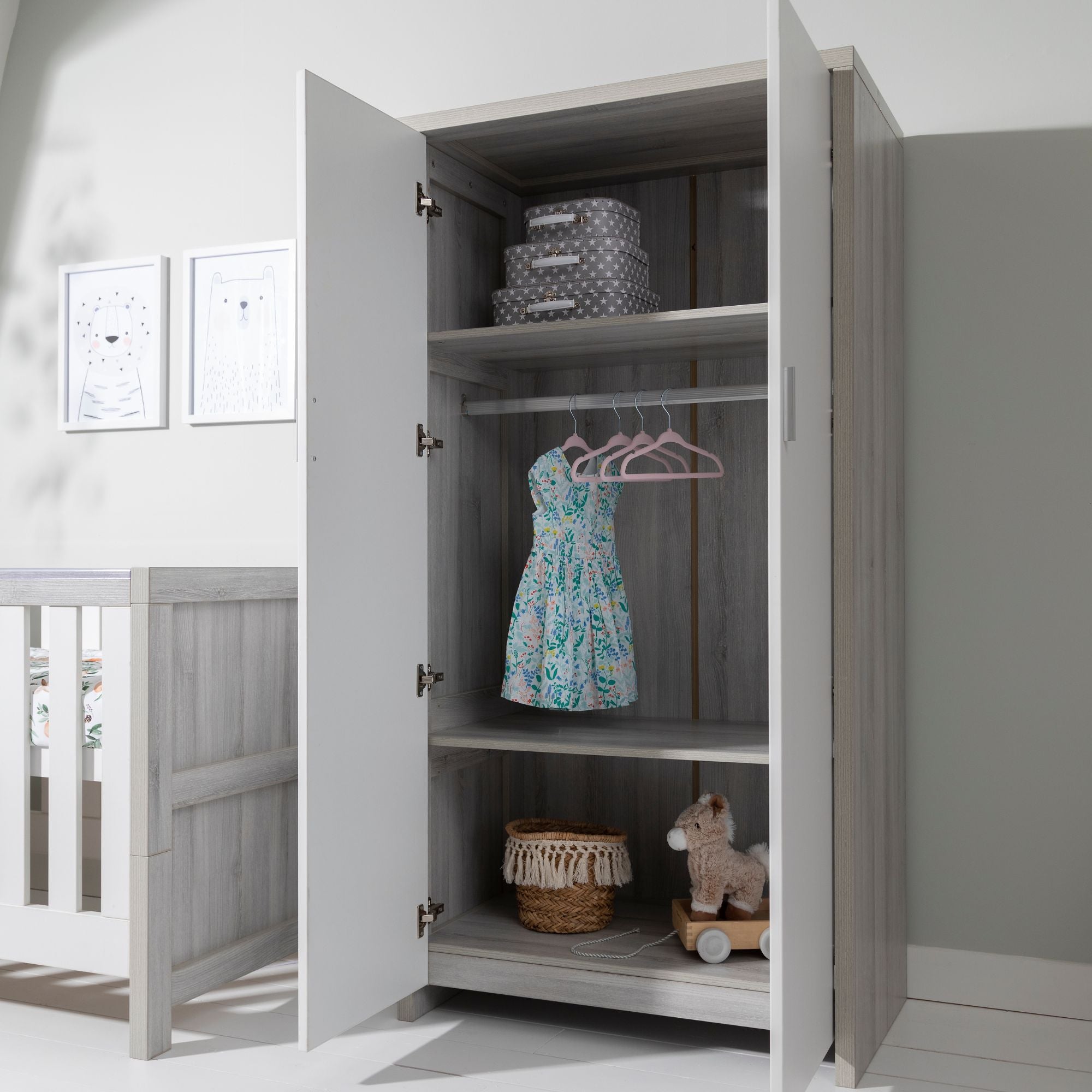 Modena wardrobe in grey ash and white with doors open, showing internal hanging rail, shelving and organised storage for children's clothing and toys