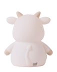 Back of a white cow-shaped night light on a white background