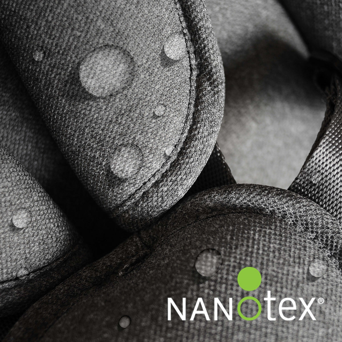 Close-up view of the Nova Rocker fabric treated with water-repellent Nanotex coating, showing protective droplet resistance for easy cleaning.