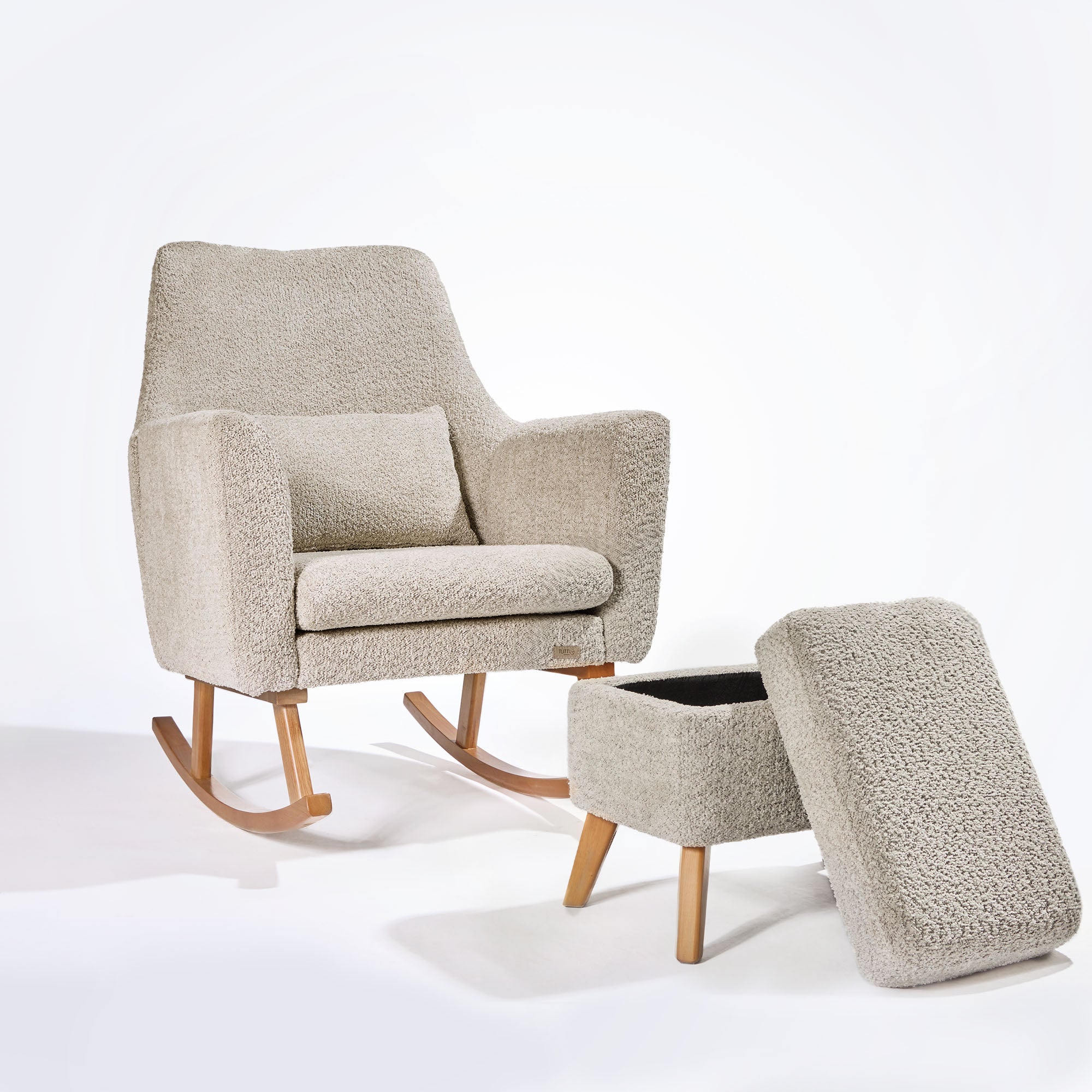 Cutout view of the Oscar Luxe chair and footstool in teddy mushroom with footstool lid open, revealing hidden storage ideal for nursery essentials