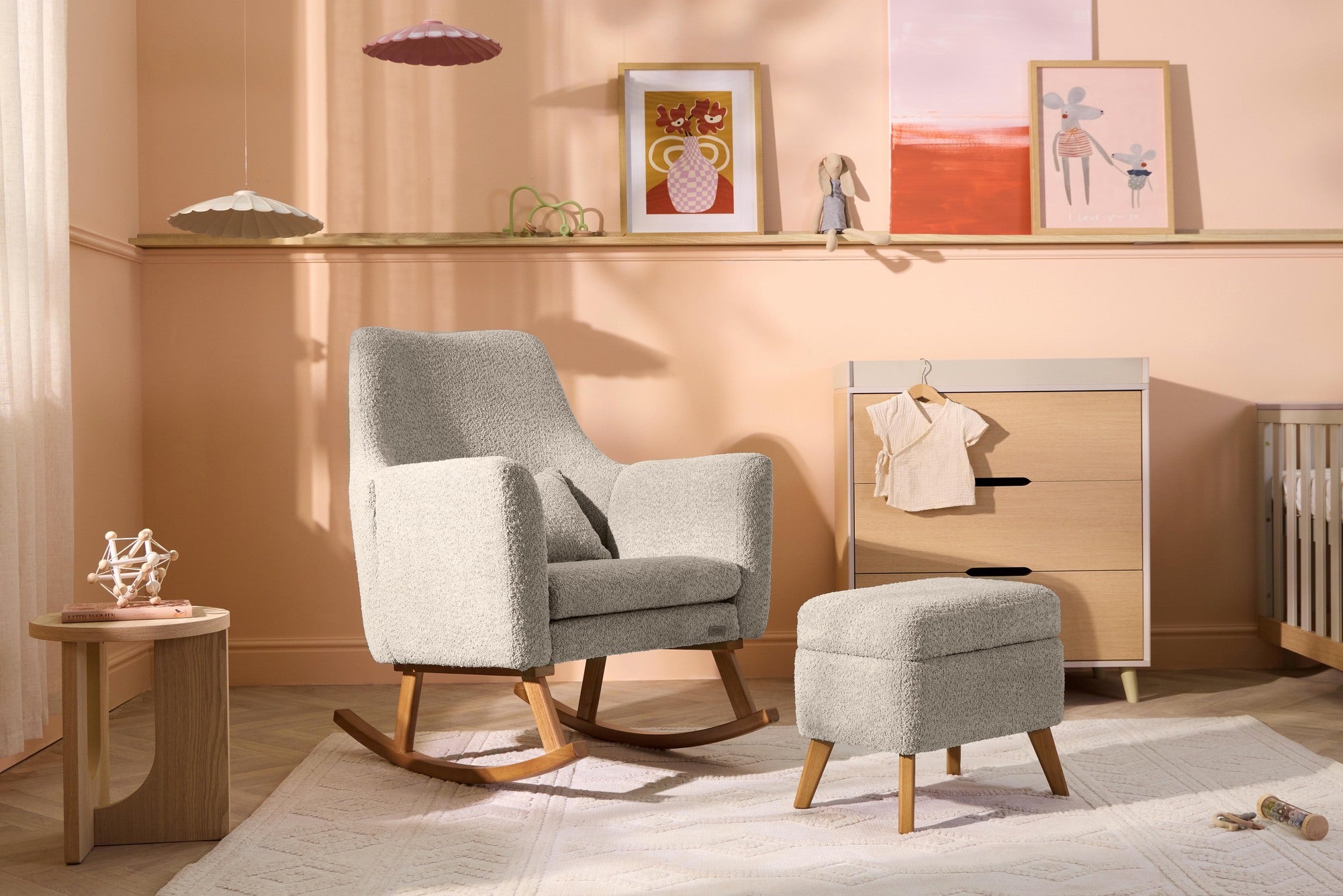 Wide nursery room view of the Oscar Luxe Rocking Chair and Footstool in Teddy Mushroom, styled to highlight generous seat and comfort