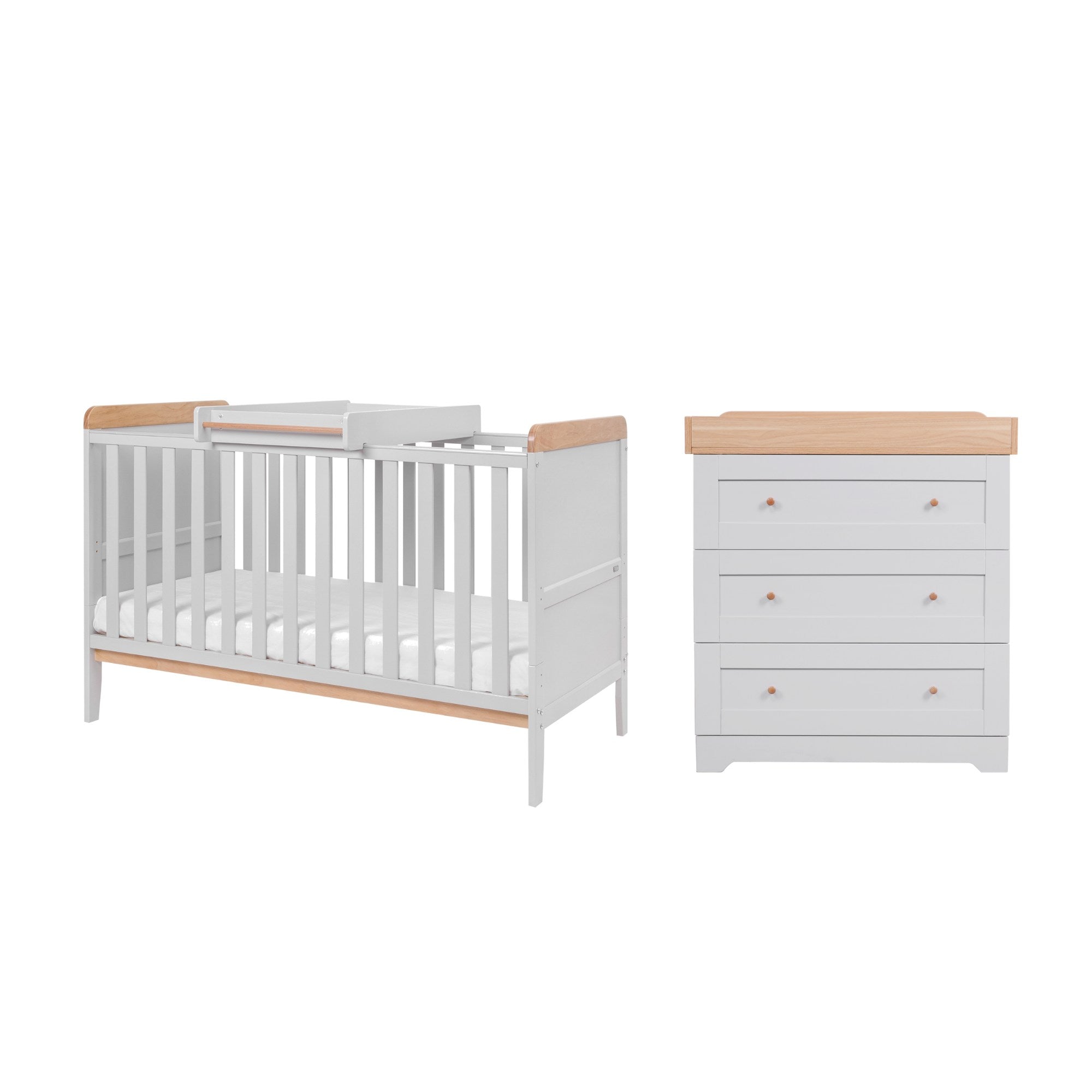 Rio nursery furniture set in dove grey and honey oak, featuring a cot bed with adjustable mattress base and a 3-drawer chest changer with a removable changing top for extended use.