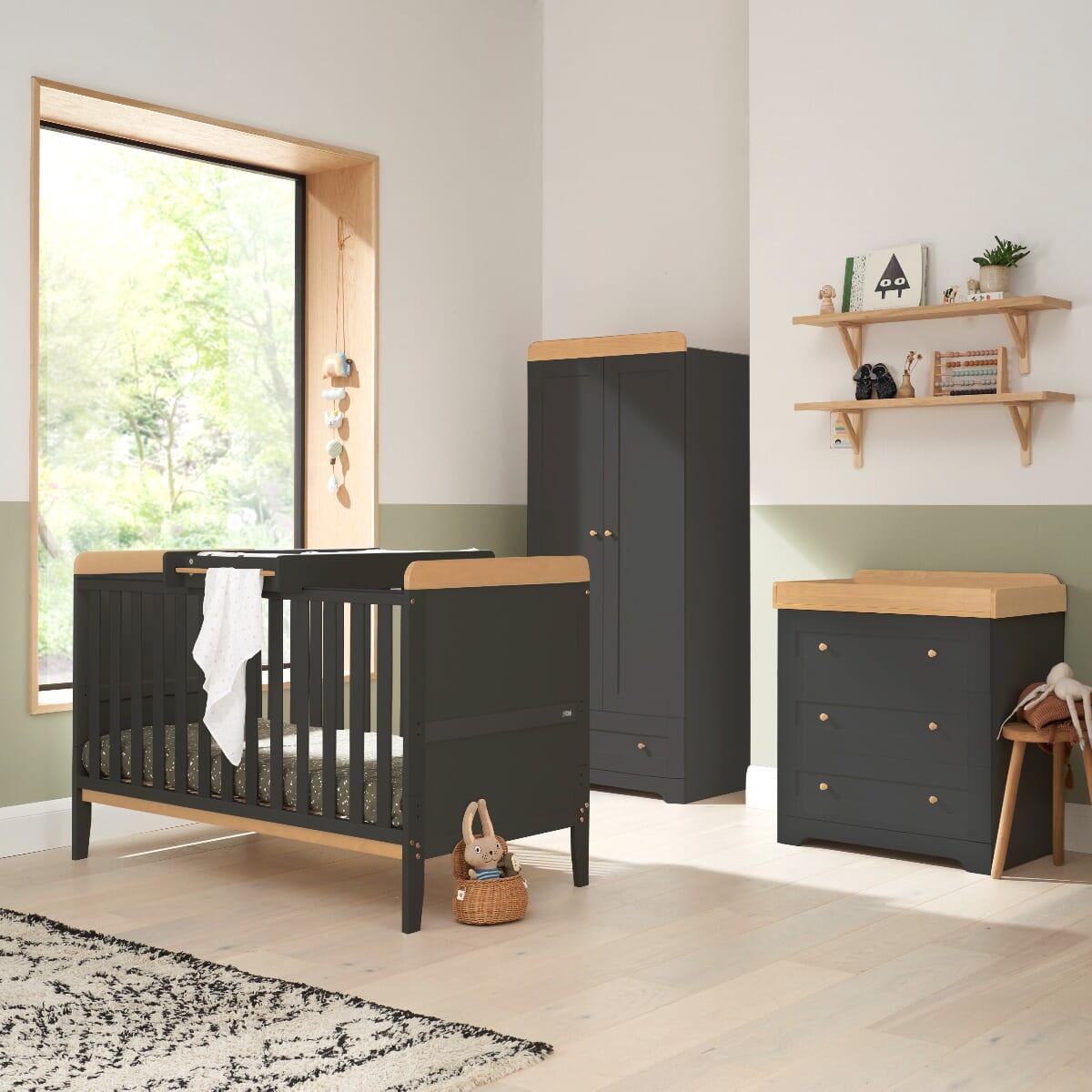 Room view of the Rio three-piece room set in Honey Oak and Slate Grey featuring the cot bed with cot top changer, spacious wardrobe with soft-close doors, and chest changer with deep drawers and removable changer top.