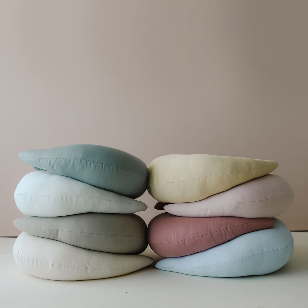 Stack of eight SMO nursing pillows, arranged in two columns to show colour options
