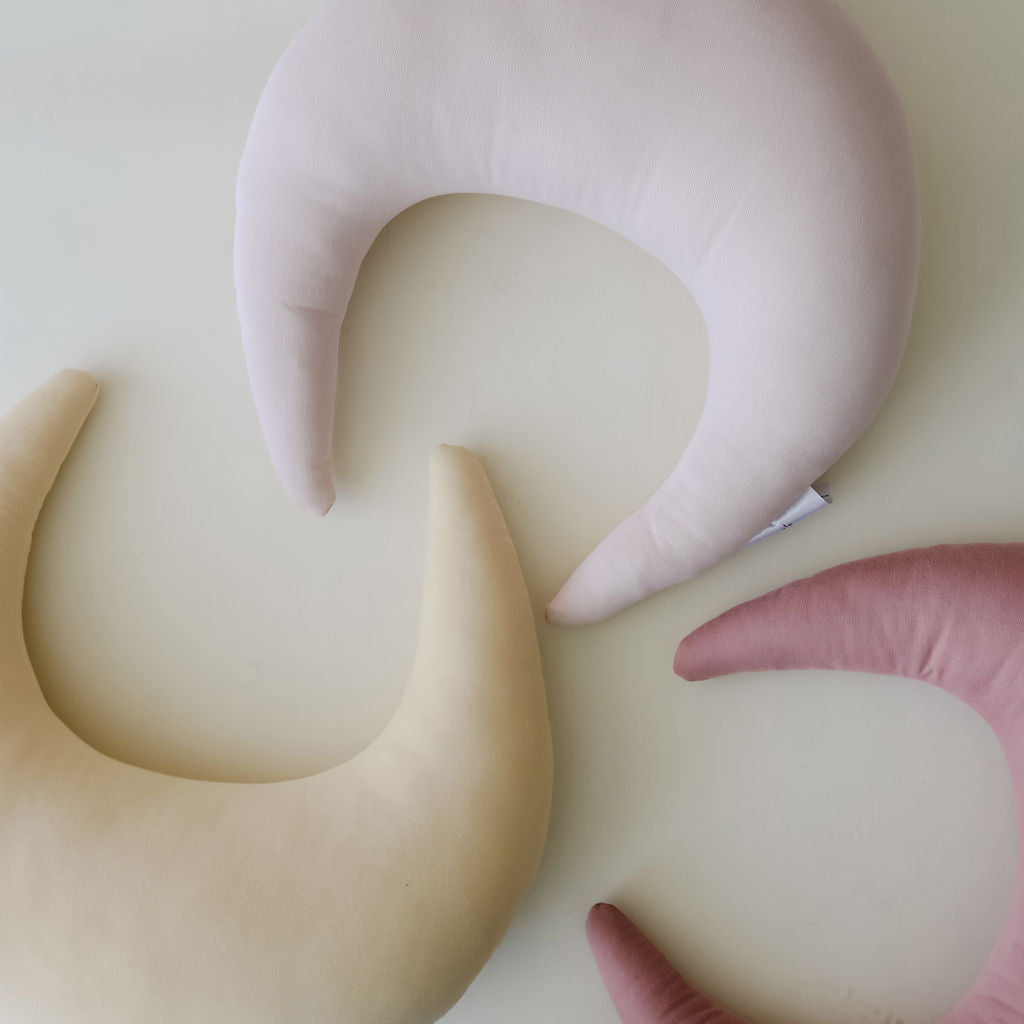 SMO nursing pillows in soft pastel shades showcasing gentle curves and smooth fabric finish