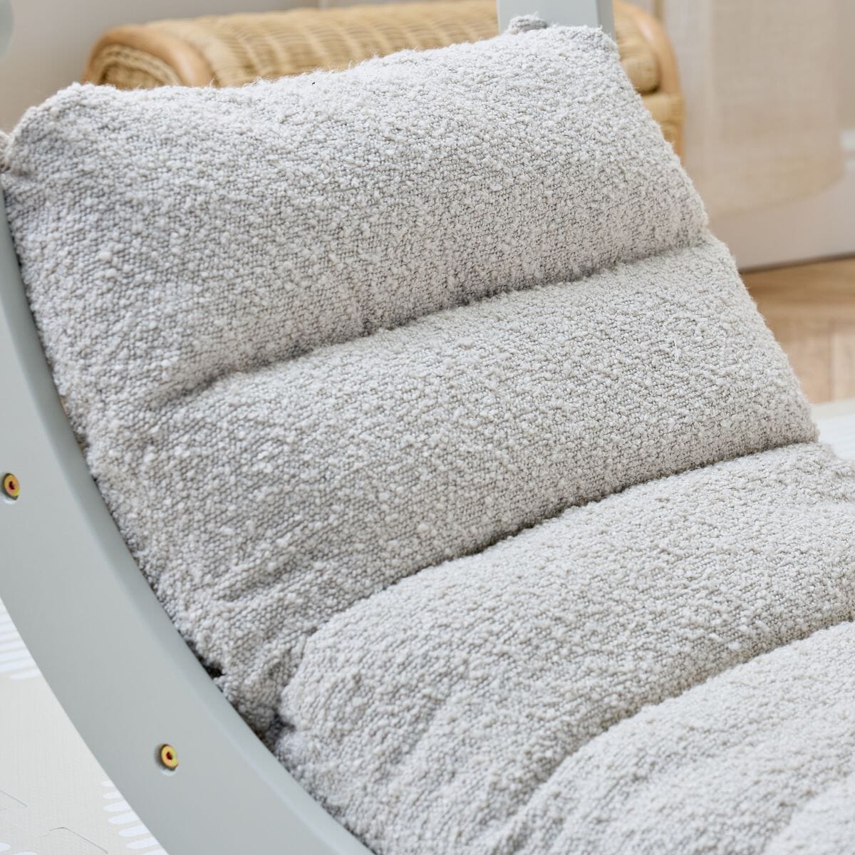 Fabric close-up of the Scala Montessori Pikler Cushion in Boucle Mushroom, showing plush texture and quilted comfort for toddlers