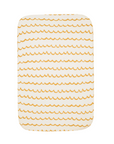 Full view of Our Planet bedside crib fitted sheet in soft cotton with calming horizontal stripe design, tailored fit for snug sleep