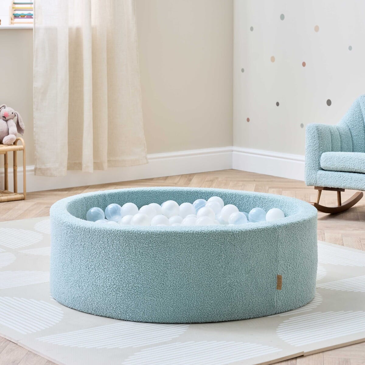 Bola Baby Ball Pit in Ocean Stone - lifestyle image of the ball pit in a playroom setting