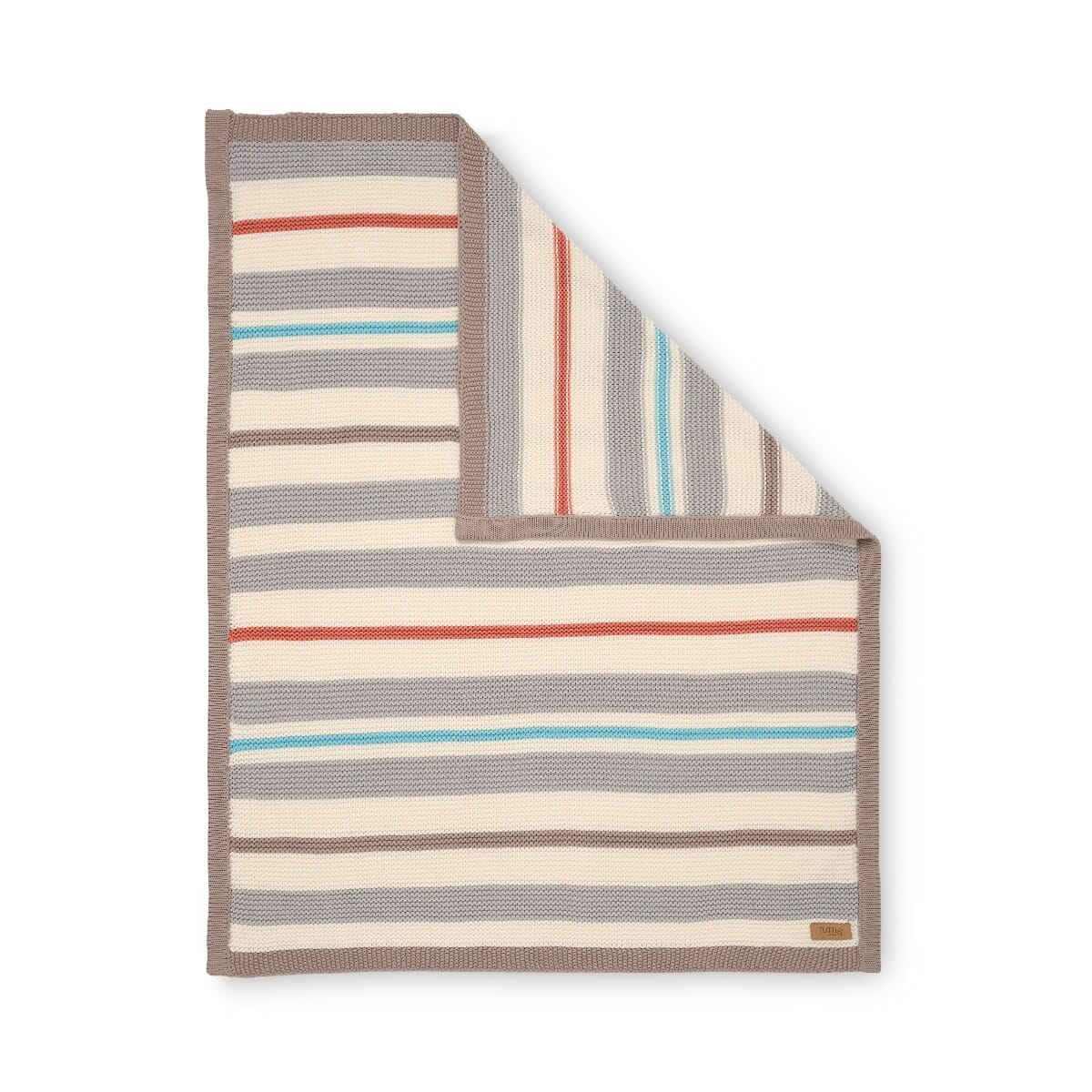 Folded corner cutout of Cocoon chunky knitted baby blanket, striped design in soft cotton with neutral and colourful accents for warmth