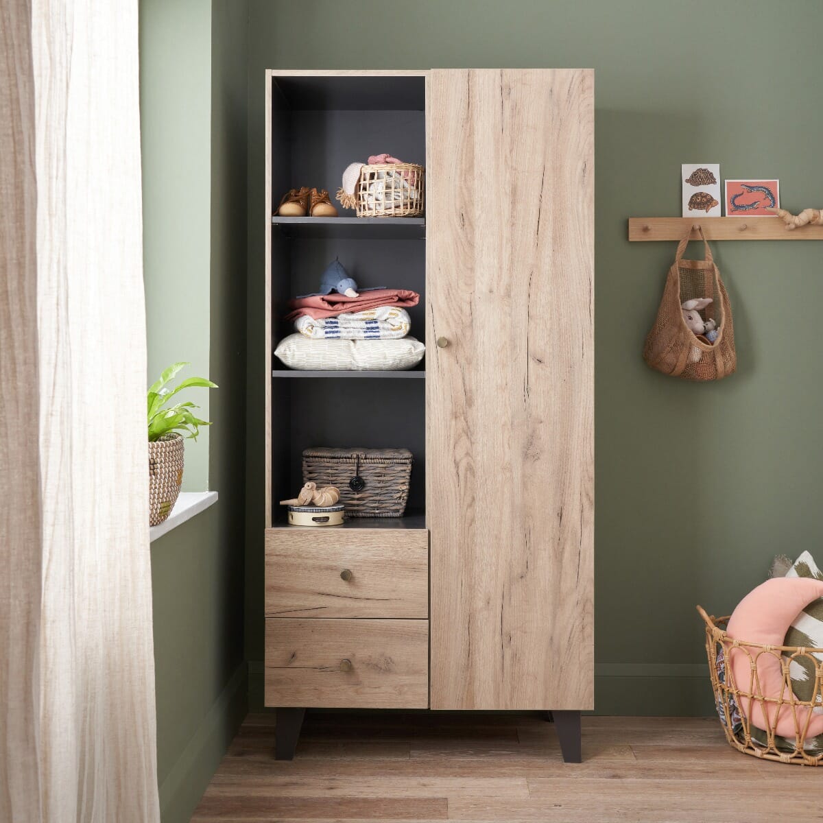 Closed door view of the Como wardrobe in distressed oak and slate grey, featuring open shelving and two drawers for versatile nursery storage