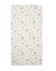 Cocoon cot bed fitted sheet with rabbit and woodland print, designed in calming neutral tones for a cosy nursery sleep space