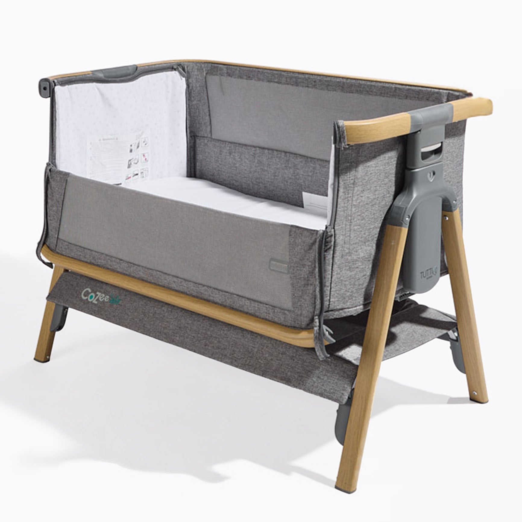 CoZee Air in Oak and Charcoal – cutout showing drop-side panel, mesh window, and rocking leg feature for soothing motion