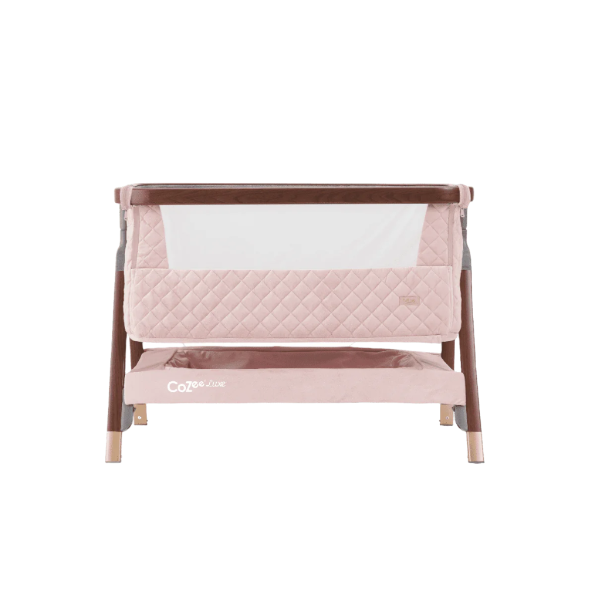 Cutout front view of the CoZee Luxe bedside crib in walnut and blush showing breathable mesh panel and quilted side detail.