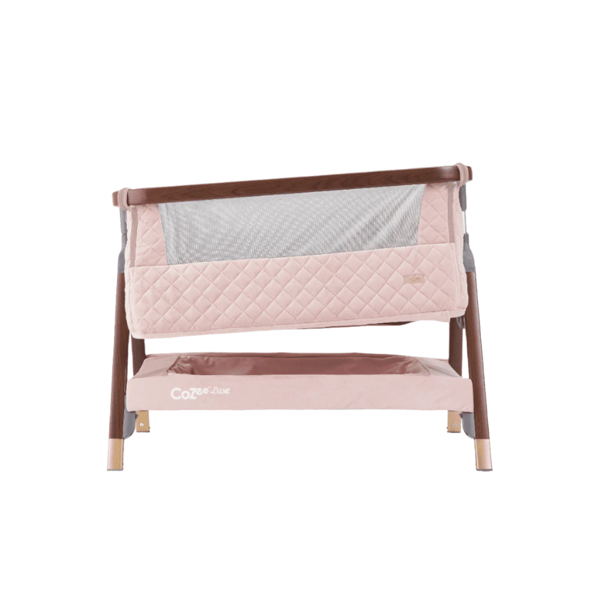 Front view of the CoZee Luxe bedside crib in walnut and blush finish with incline feature to support reflux relief and comfort.
