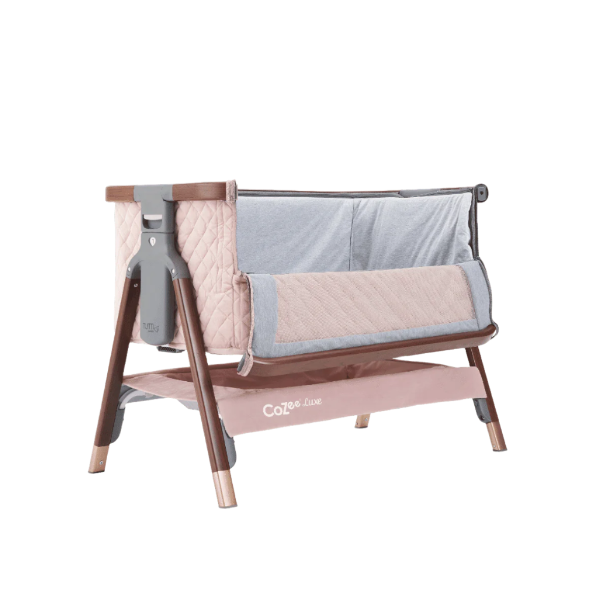 Side angle of the CoZee Luxe bedside crib in walnut and blush with zipped-down mesh panel for safe and easy bedside access.