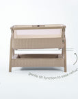 CoZee Sense bedside crib in soft walnut and cocoa demonstrating gentle incline setting to help ease reflux.
