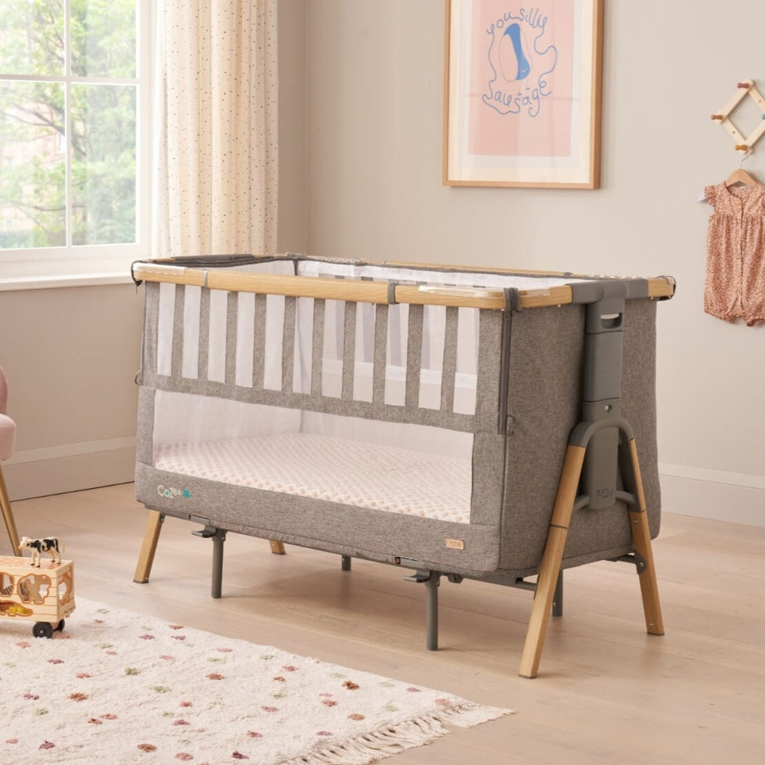 CoZee XL in oak and charcoal set up as a full-size cot, featuring slatted sides, grey fabric, and a spacious sleeping area