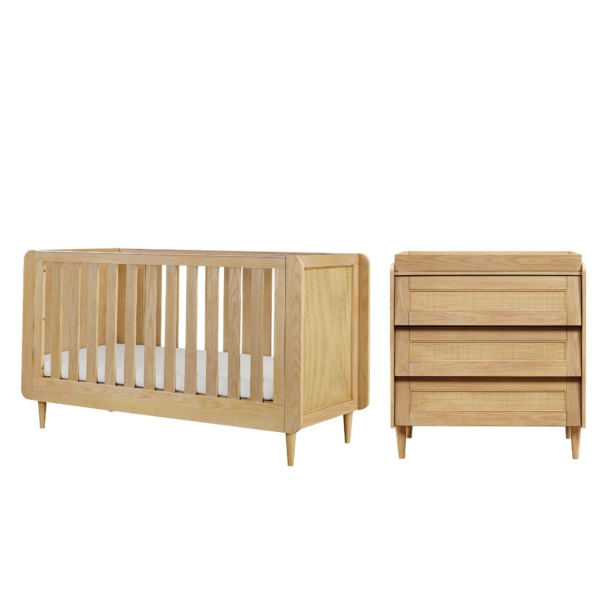 Cutout view of the Japandi 2-piece nursery furniture set in light oak, includes cot bed and chest changer with rattan accents for a minimalist aesthetic.