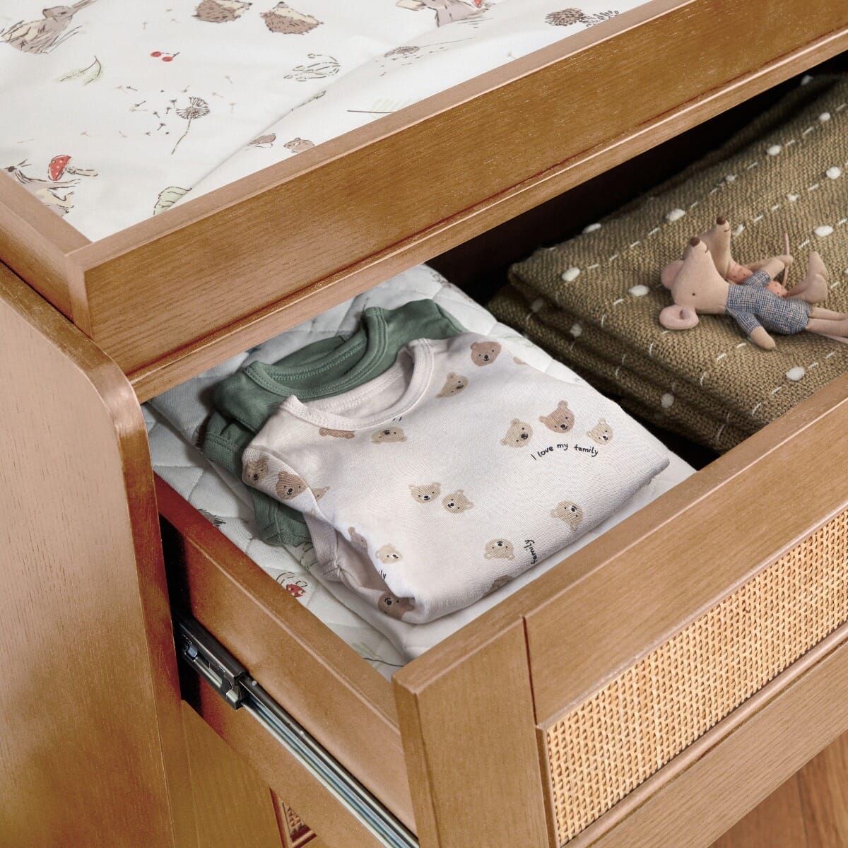 Open drawer view of the japandi chest changer in light oak revealing smooth-glide runners and deep storage ideal for daily baby essentials.
