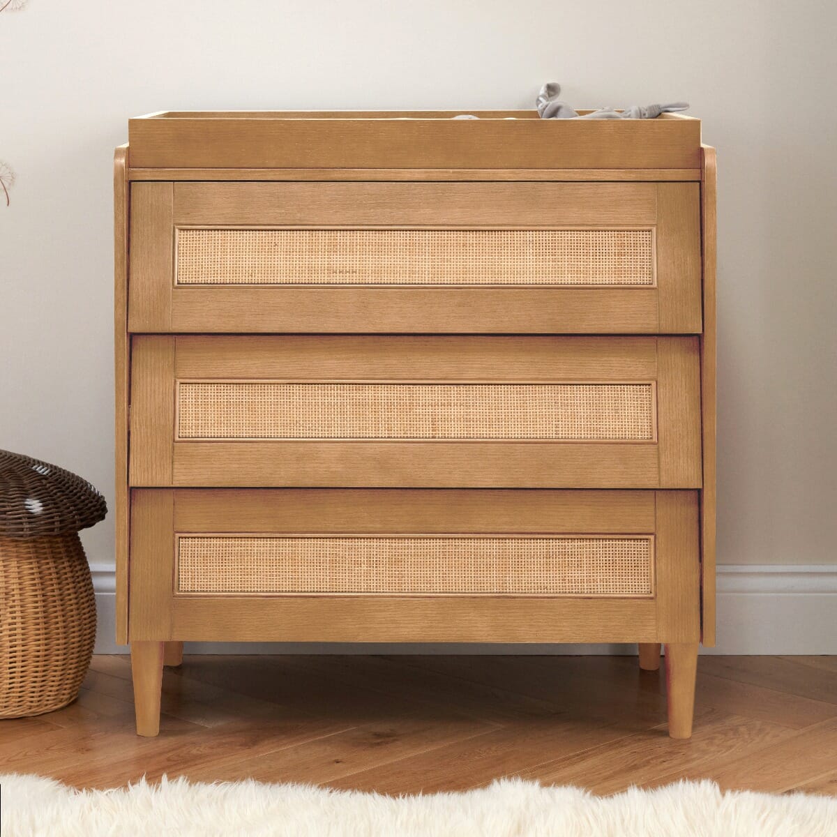 Japandi chest changer in light oak with three spacious drawers and a removable changing top, combining modern aesthetics with practical changing station functionality.