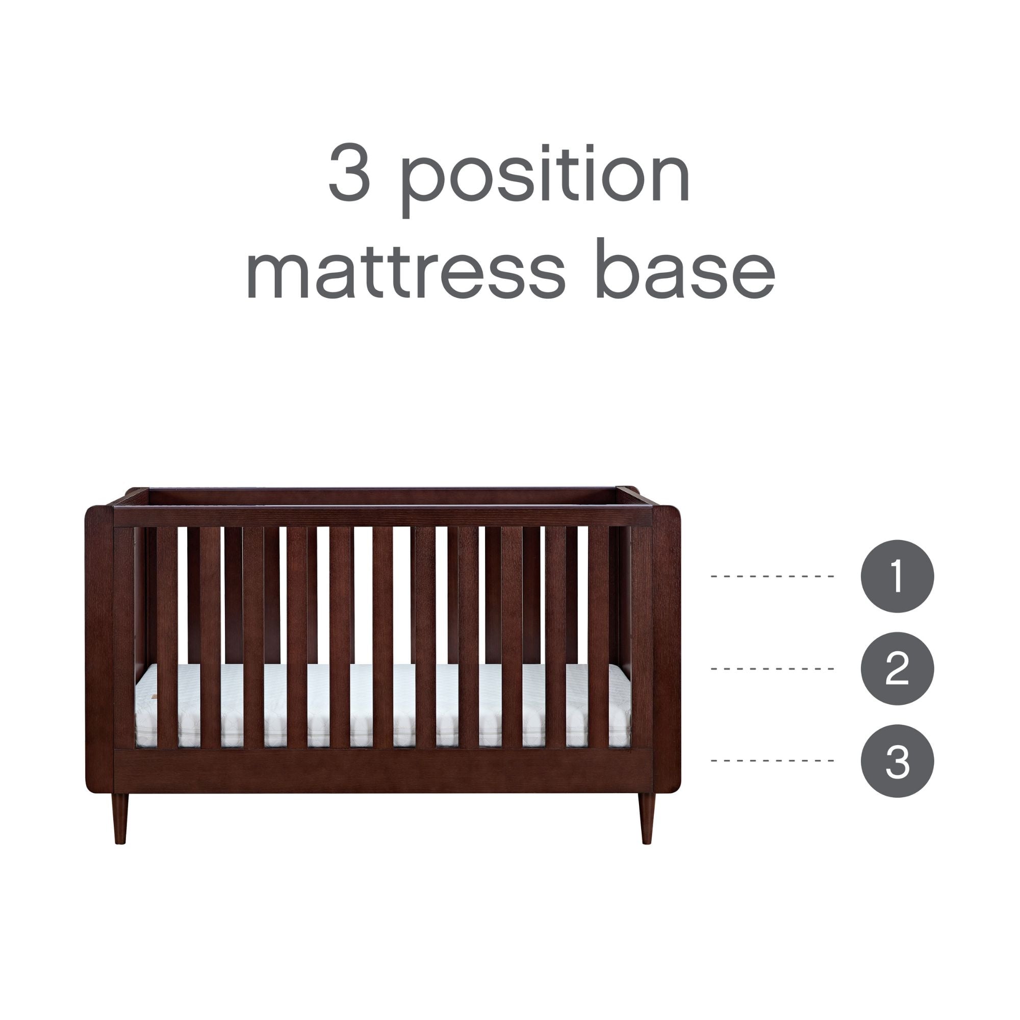 Japandi cot bed in warm walnut with adjustable 3-position mattress base, allowing for safe and ergonomic sleeping heights as your baby grows.