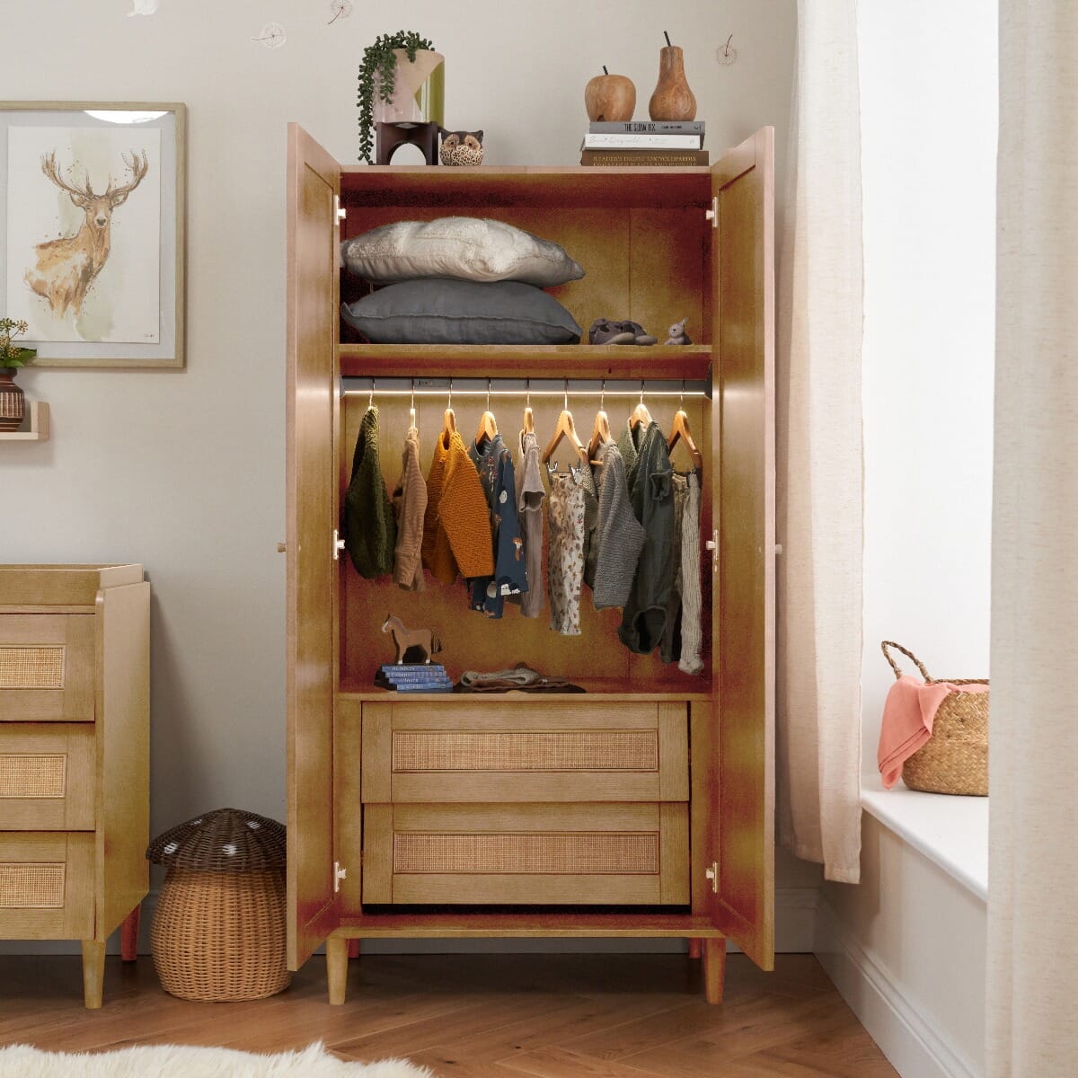 Japandi wardrobe in light oak with both doors open, showing internal rail, shelves and two lower drawers in a styled nursery room.