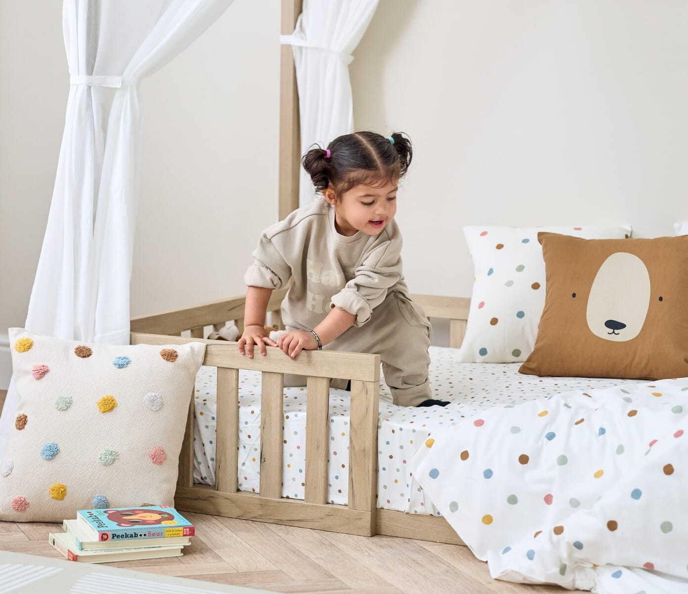 Casa Grande Montessori Kids Floor Bed in Harvest Oak - lifestyle image of the floor bed in a room setting without the curtains on
