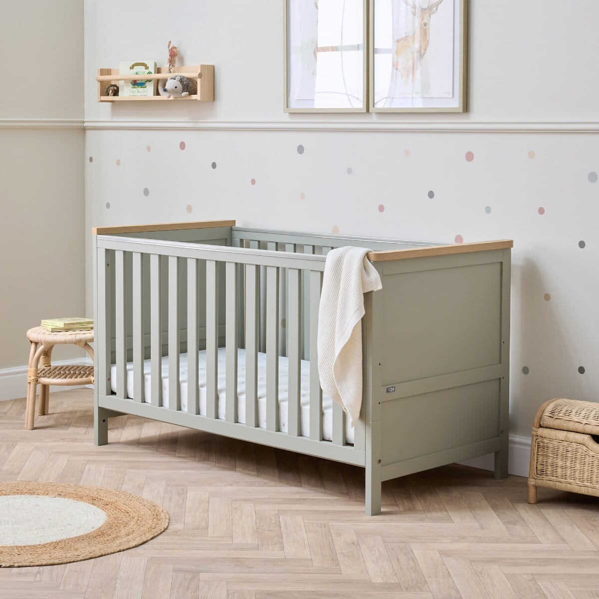 Misha Cot Bed in Sage & Golden Oak - lifestyle image in a nursery setting