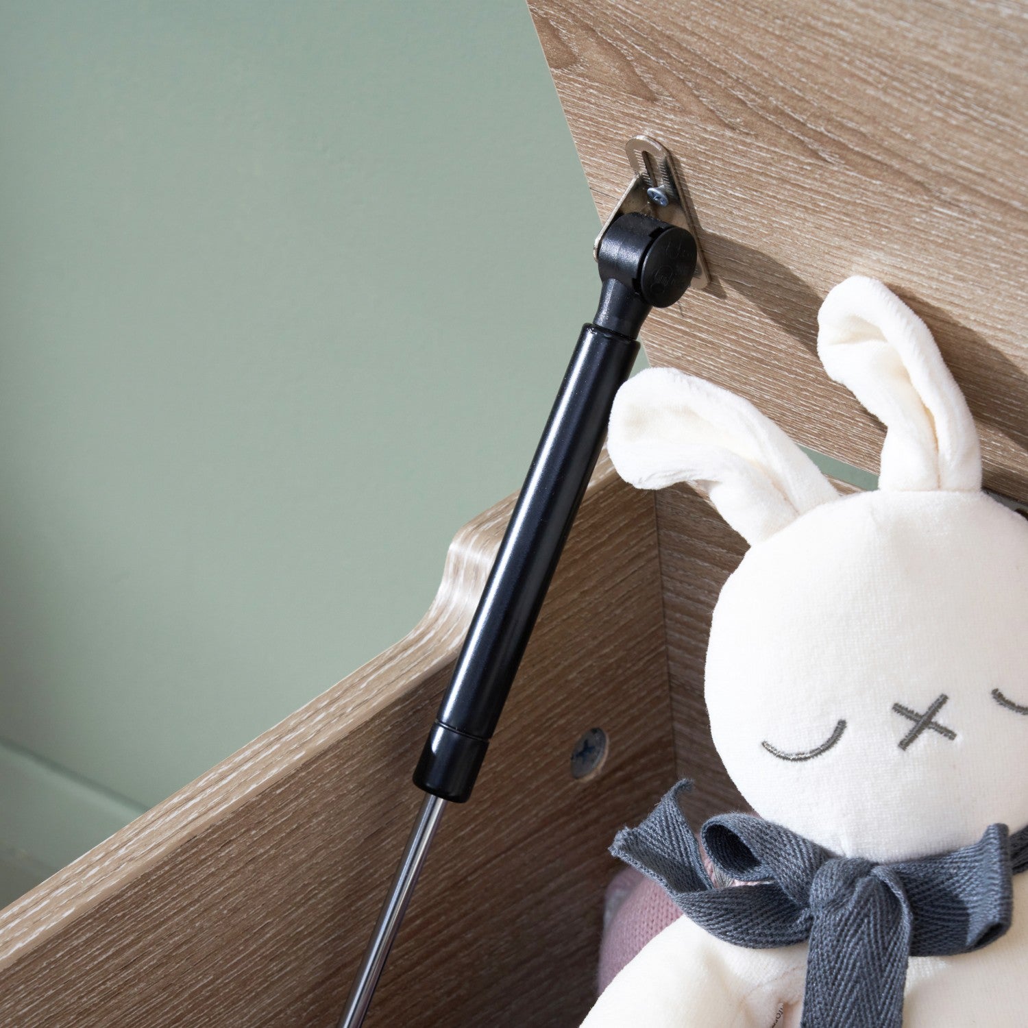 Modena Toy Box Oak featuring a soft-closing hinge mechanism to keep the lid safely propped open, protecting little fingers from accidental closures