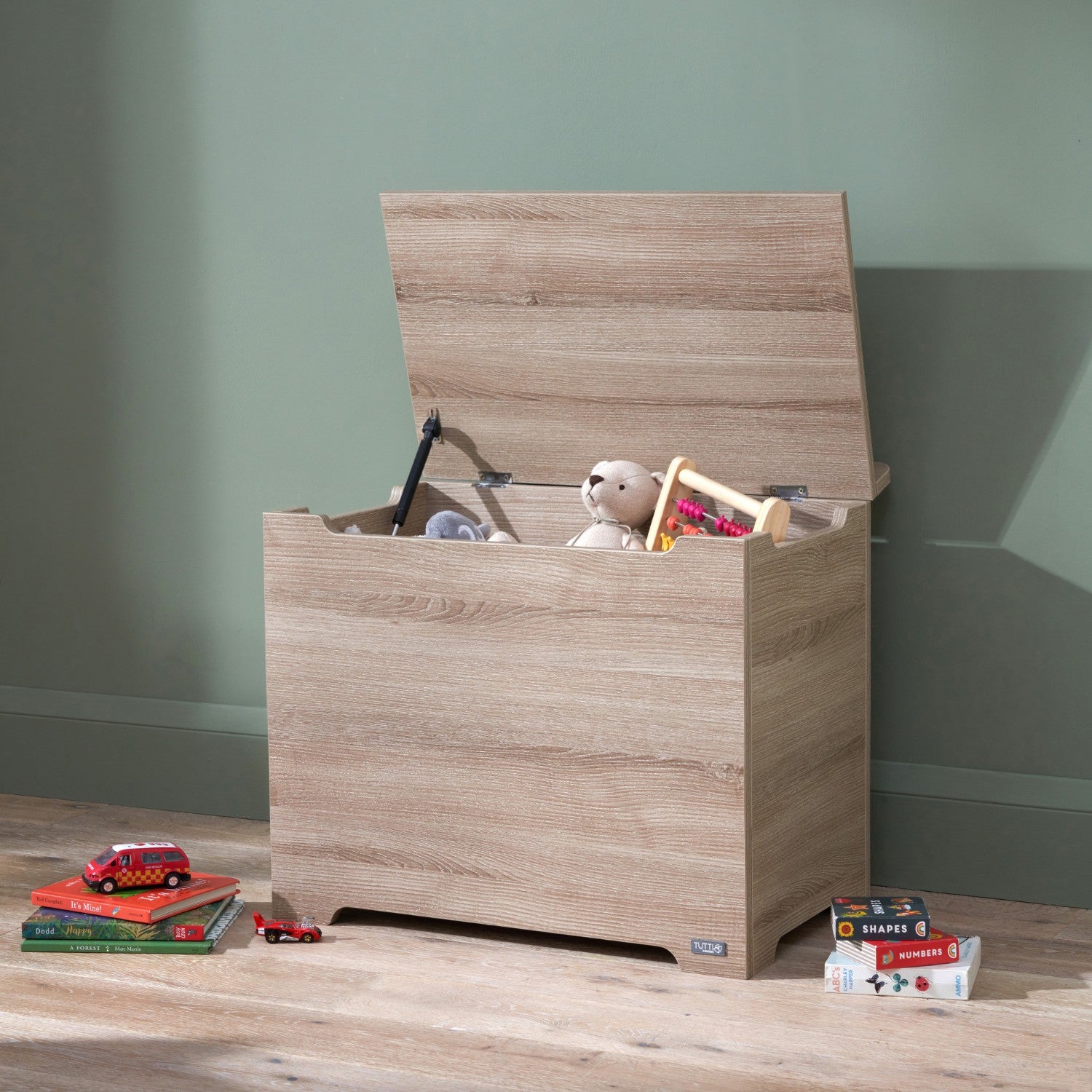 Modena Toy Box Oak styled in a modern nursery room, combining functional toy storage with a clean and natural wood-look aesthetic