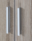 Close-up view of Modena wardrobe handles in oak finish, showing sturdy and modern silver handles designed for easy opening and secure closing of the wardrobe doors.