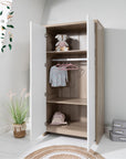 Modena wardrobe in white and oak with white double doors open, showing internal hanging rail, adjustable shelving and spacious storage compartments