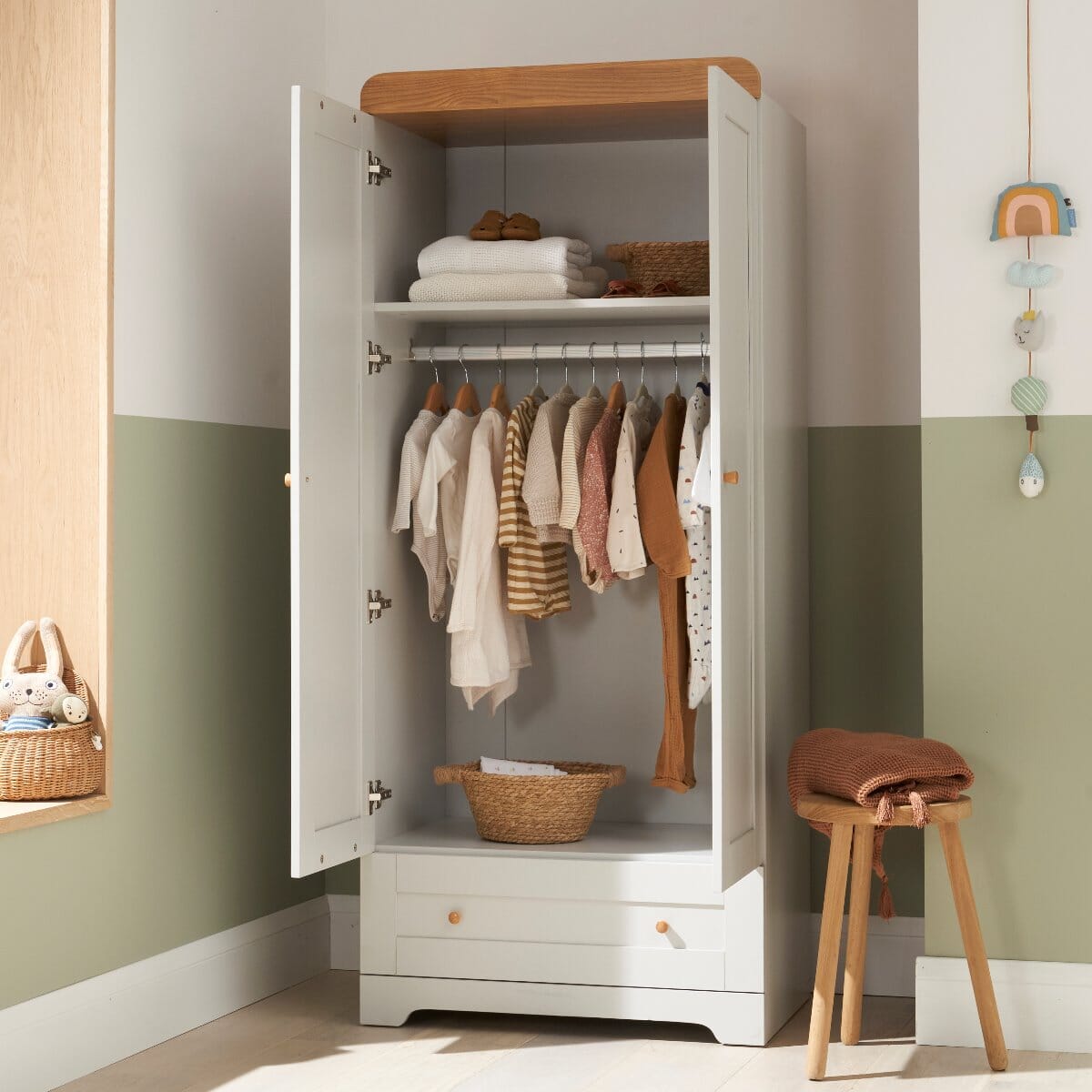 Lifestyle view of the Rio wardrobe in dove grey and oak with doors open, hanging rail, shelf and drawer shown in use