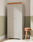 Room setting front view of Rio Wardrobe in Dove Grey and Honey Oak with stylish soft-close doors and practical bottom drawer