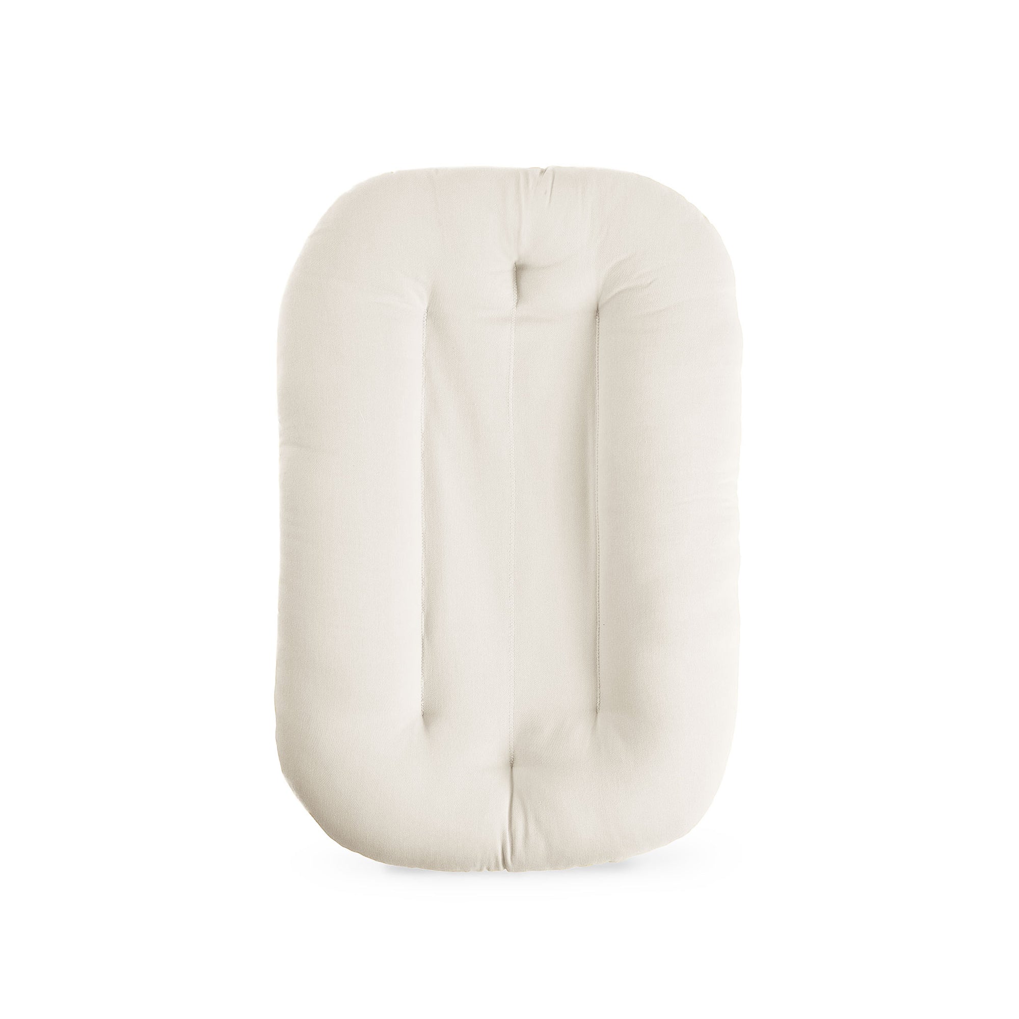 Cutout of the Snuggle Me Newborn Baby Lounger in natural, showing its ergonomic shape and softly padded cotton cover in a neutral shade.