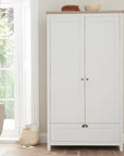 Verona wardrobe in white and oak with spacious interior storage, perfect for organising baby clothes and essentials.