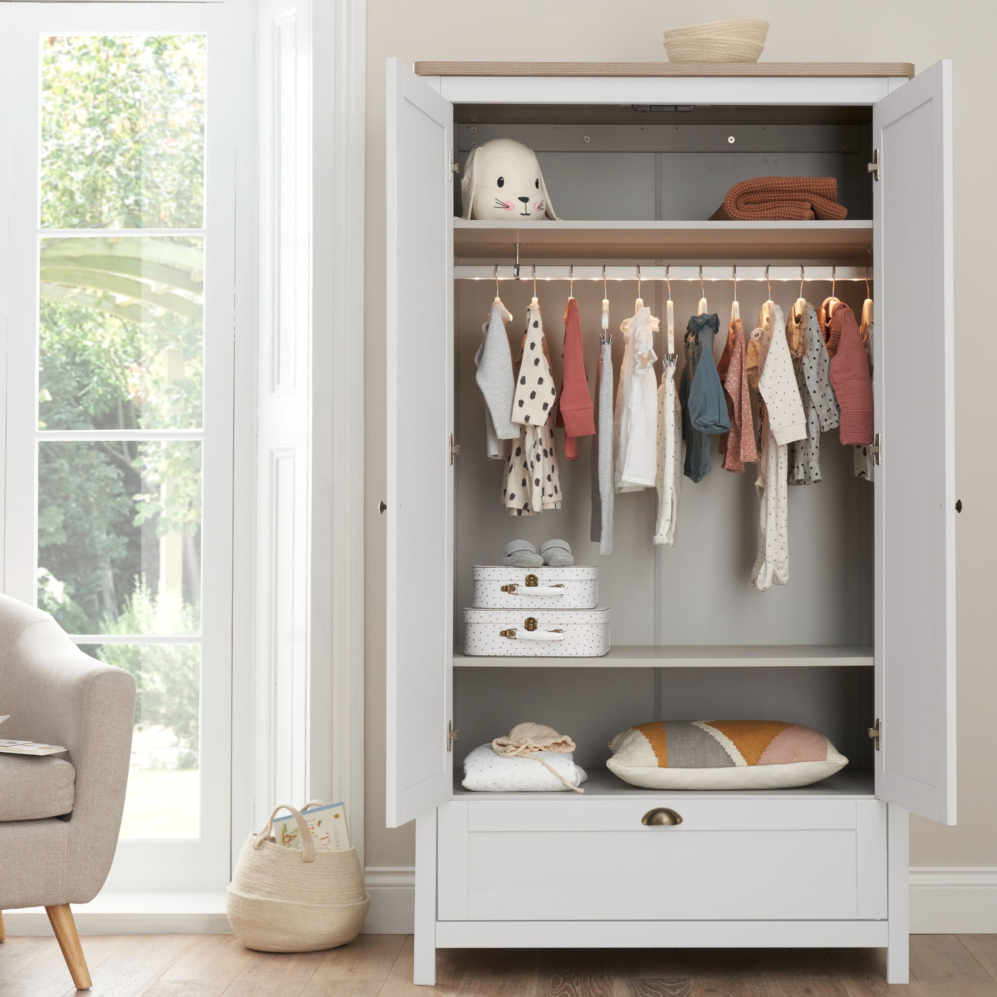 Verona wardrobe in white and oak with doors open – includes hanging rail, shelves, and lower drawer for flexible nursery storage