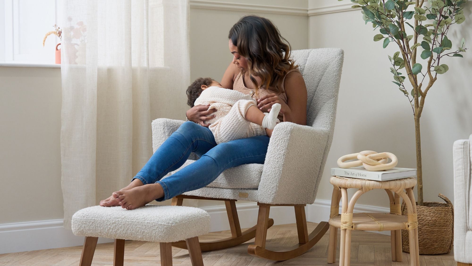 Image showing mum and baby cuddling on the Jonah Luxe nursing chair in Mushroom.